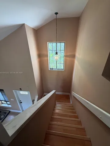 a view of entryway with wooden floor