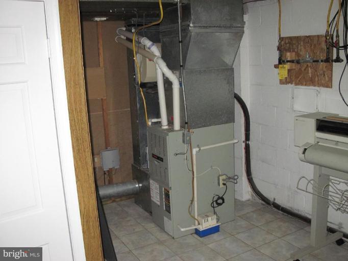 5607 Huntland Road Temple Hills, MD 20748 - Photo 12 of 19 High Efficency Gas Furnace & Air Handler