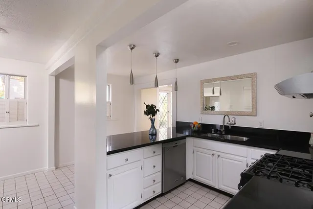 a double vanity sink and a mirror