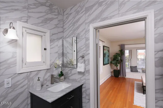 a spacious bathroom with a sink and a mirror