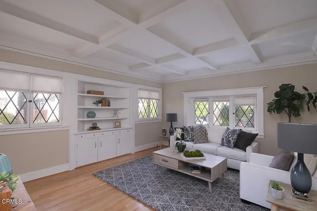 a living room with furniture and a rug