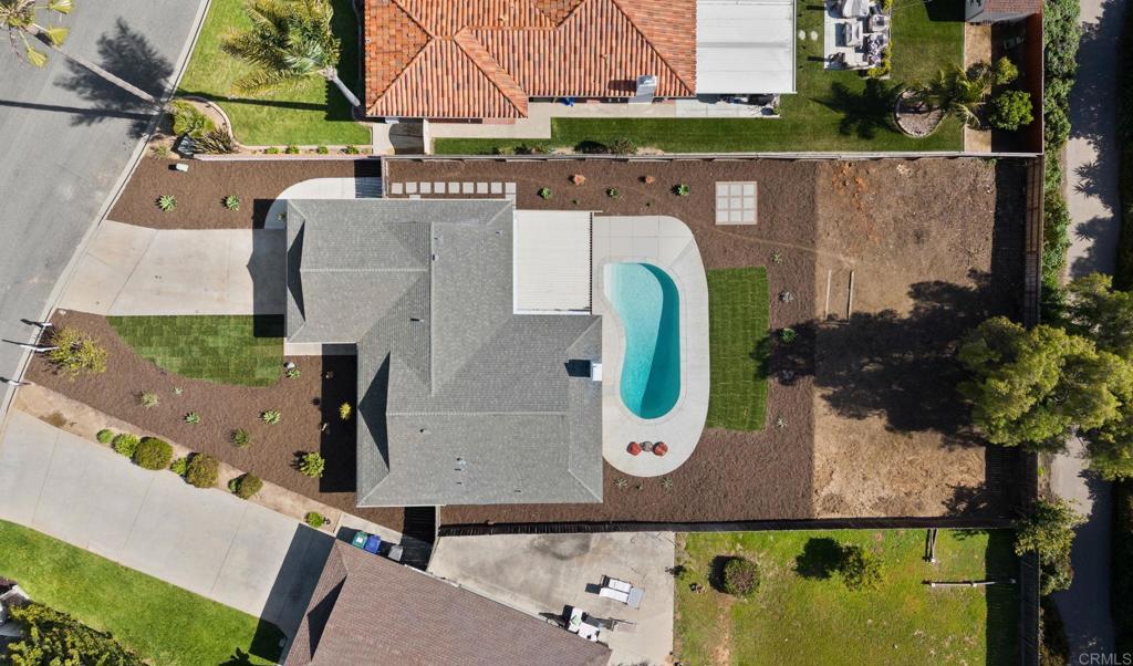 an aerial view of a house with swimming pool