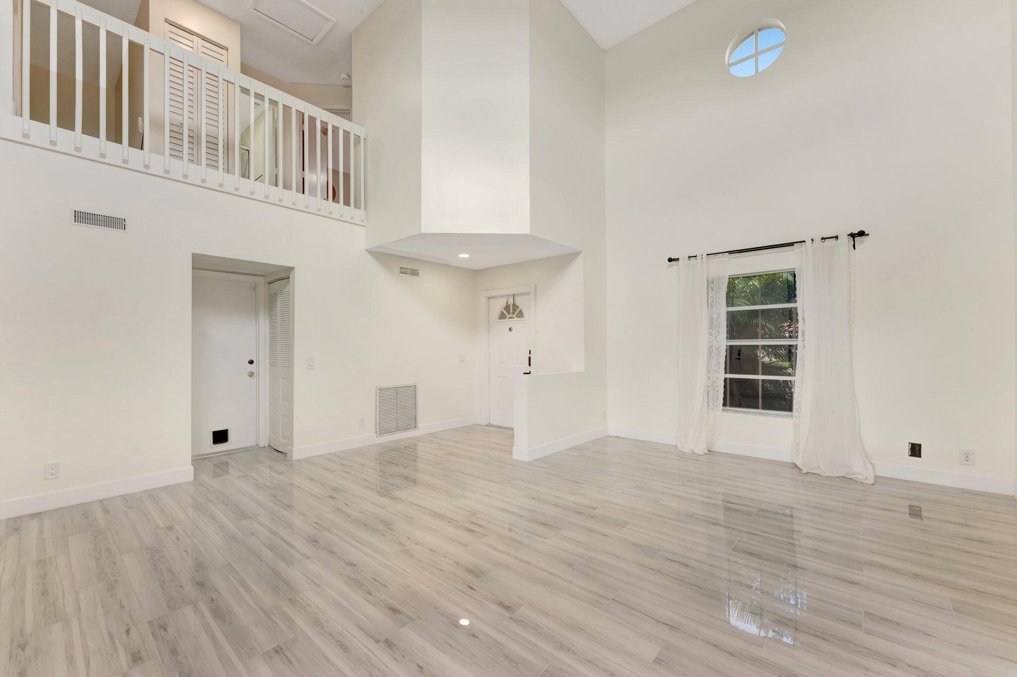 1388 Garden Road Weston, FL 33326 - Photo 9 of 46 Family and Dining with Garage Door