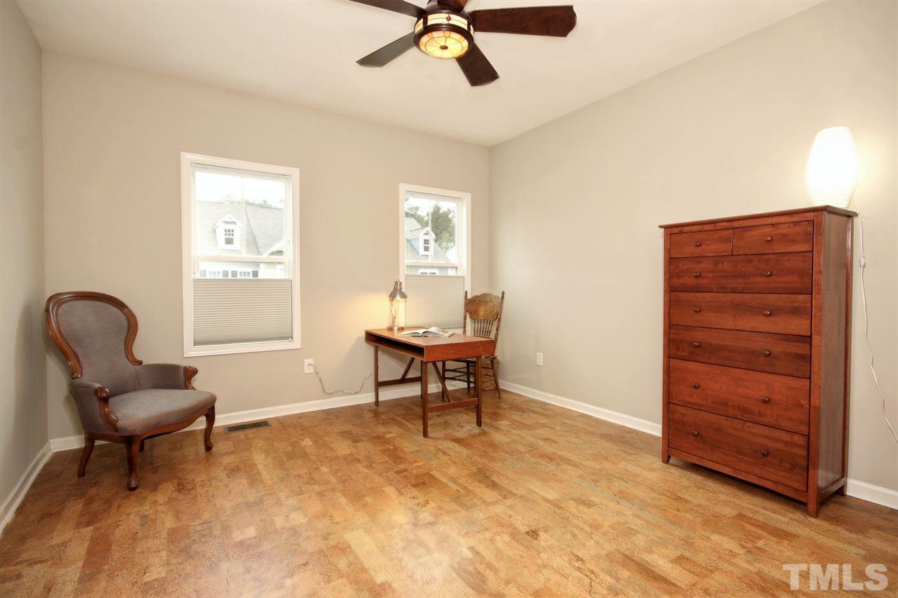 620 Edgewater Ridge Court Apex, NC 27523 - Photo 22 of 30 a living room with furniture and a window
