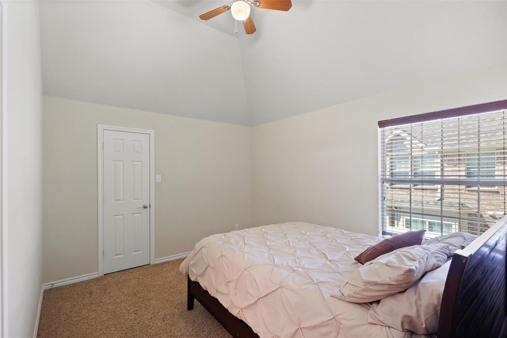 10414 Broadmoor Lane Rowlett, TX 75089 - Photo 28 of 38 Bedroom with carpet floors and ceiling fan