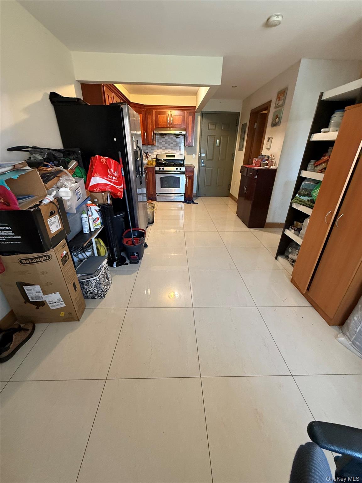 37-17 111th Street, Unit 2D Queens, NY 11368 - Photo 3 of 8 a view of a livingroom with furniture and garage
