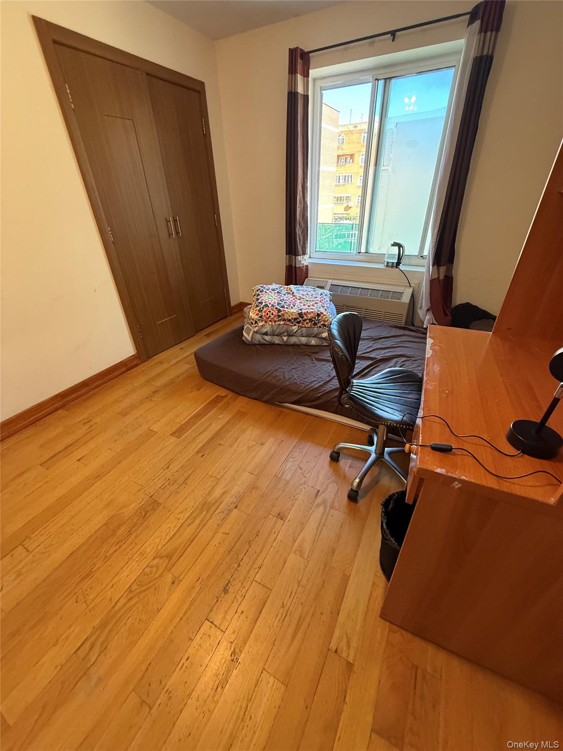 37-17 111th Street, Unit 2D Queens, NY 11368 - Photo 6 of 8 a room with a window