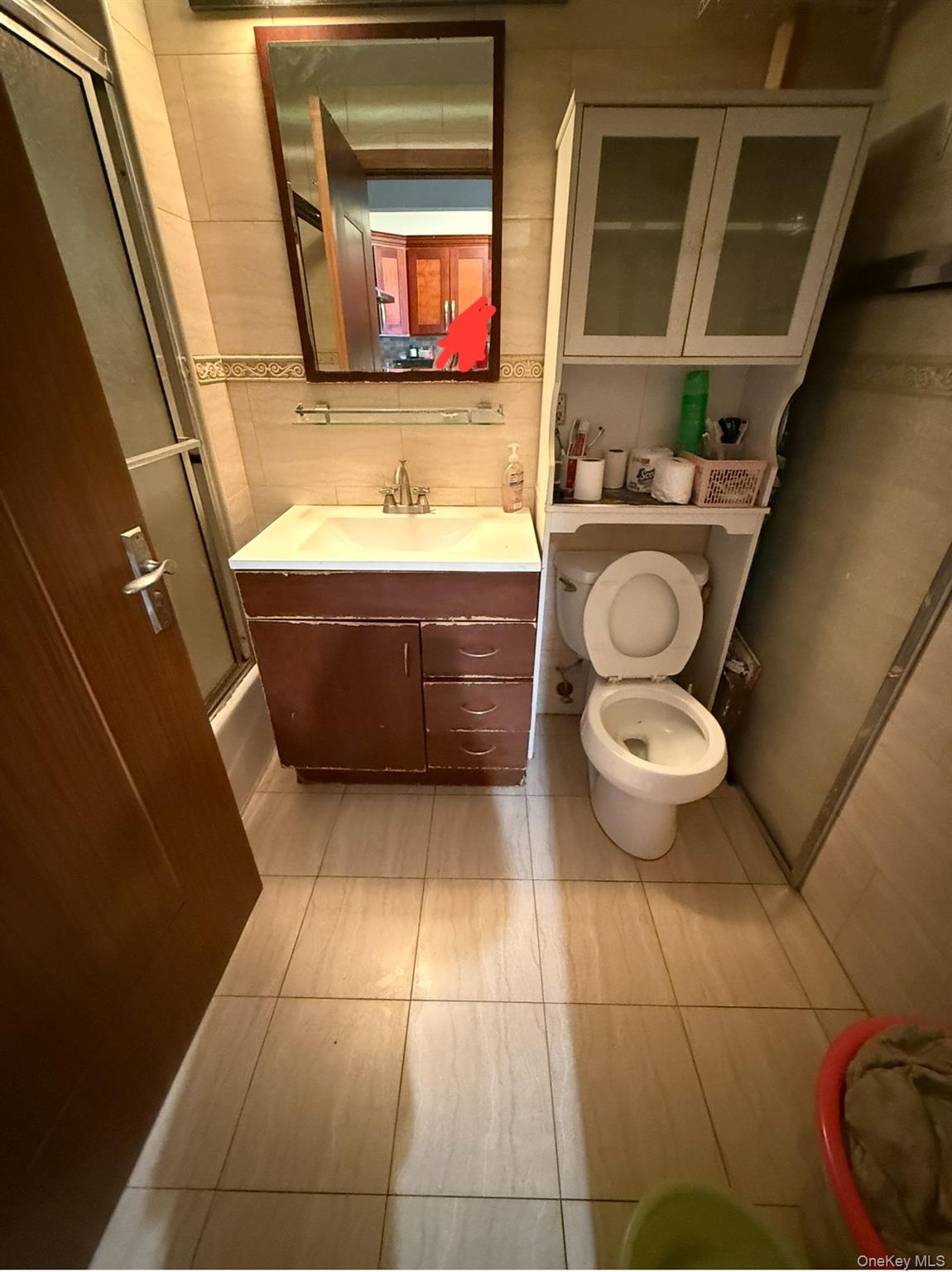 37-17 111th Street, Unit 2D Queens, NY 11368 - Photo 8 of 8 a bathroom with a sink and a mirror