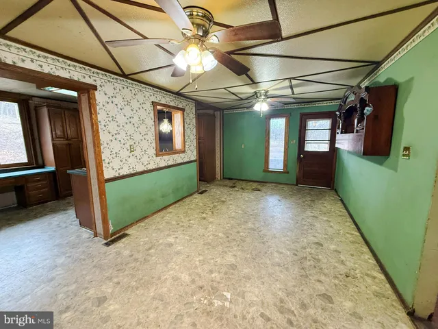 a view of a hallway with a window