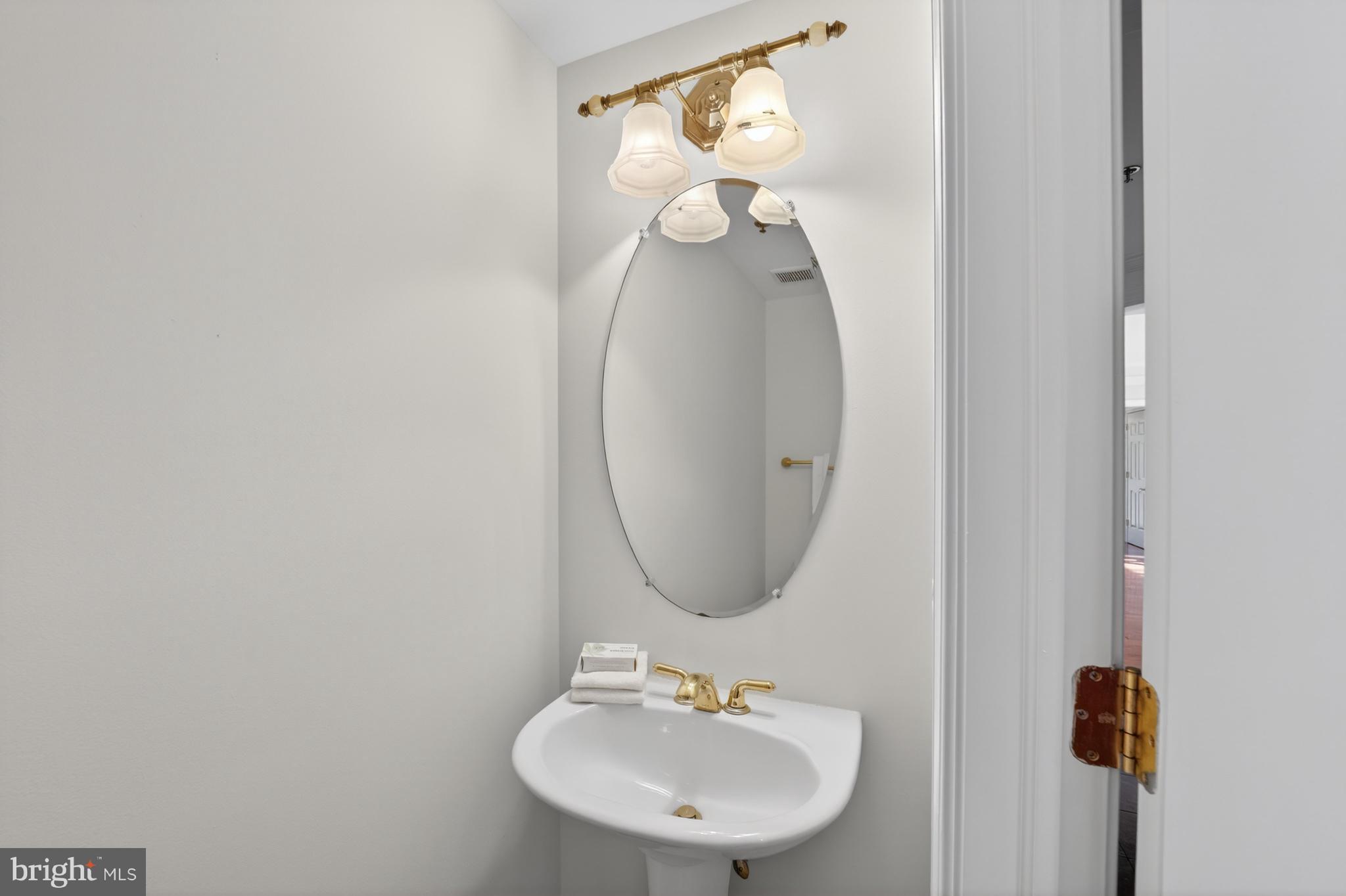 1555 North Colonial Terrace, Unit 601 Arlington, VA 22209 - Photo 13 of 24 a bathroom with a sink and a mirror