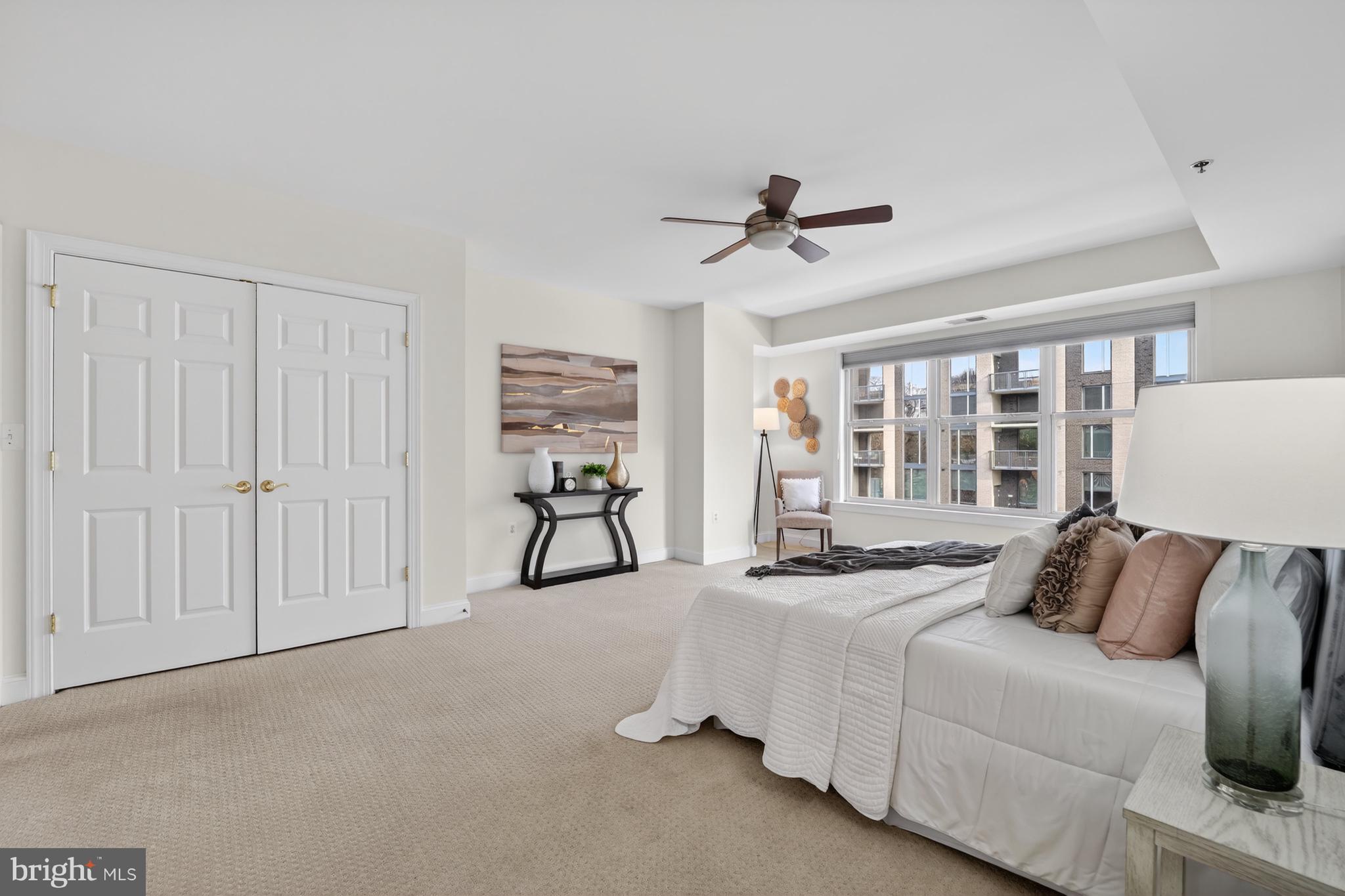 1555 North Colonial Terrace, Unit 601 Arlington, VA 22209 - Photo 15 of 24 a bedroom with furniture and a ceiling fan