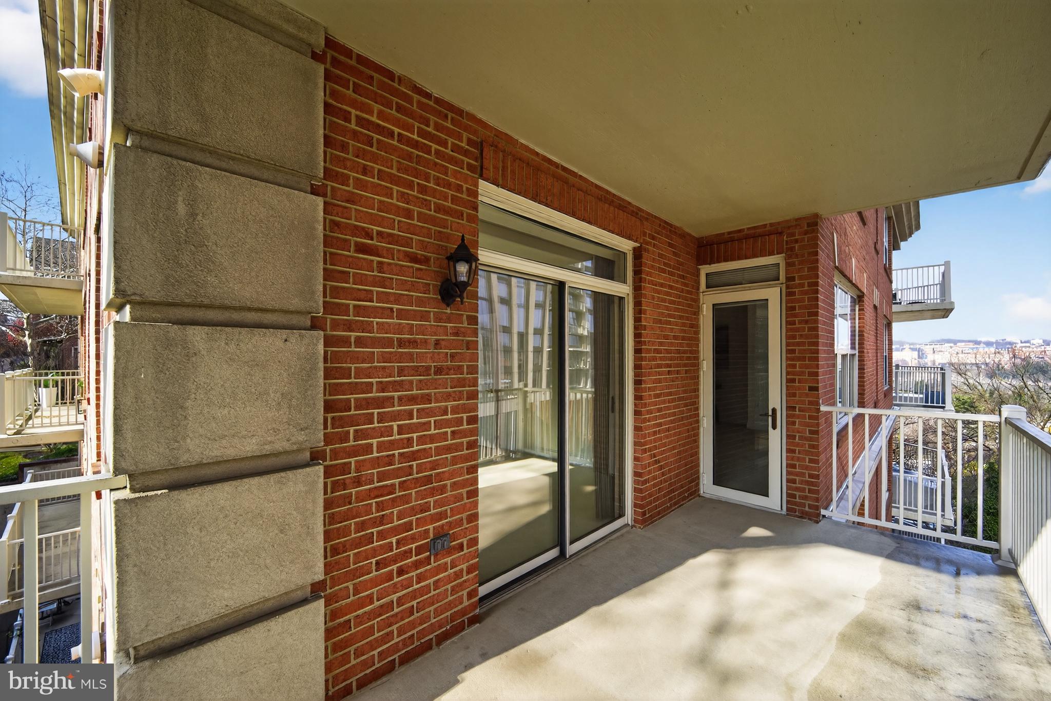 1555 North Colonial Terrace, Unit 601 Arlington, VA 22209 - Photo 17 of 24 a view of a porch with a door and chair