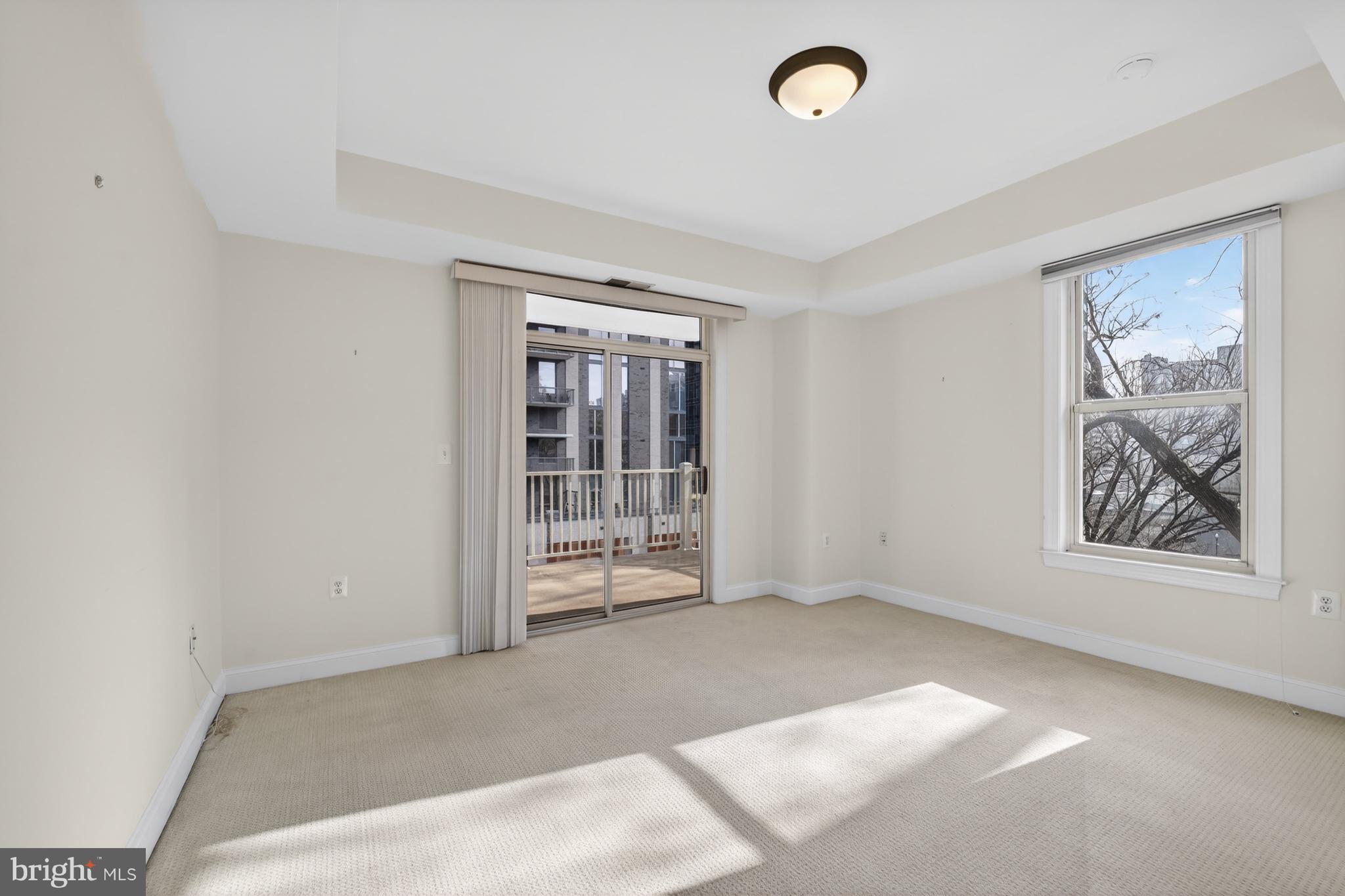 1555 North Colonial Terrace, Unit 601 Arlington, VA 22209 - Photo 19 of 24 an empty room with windows