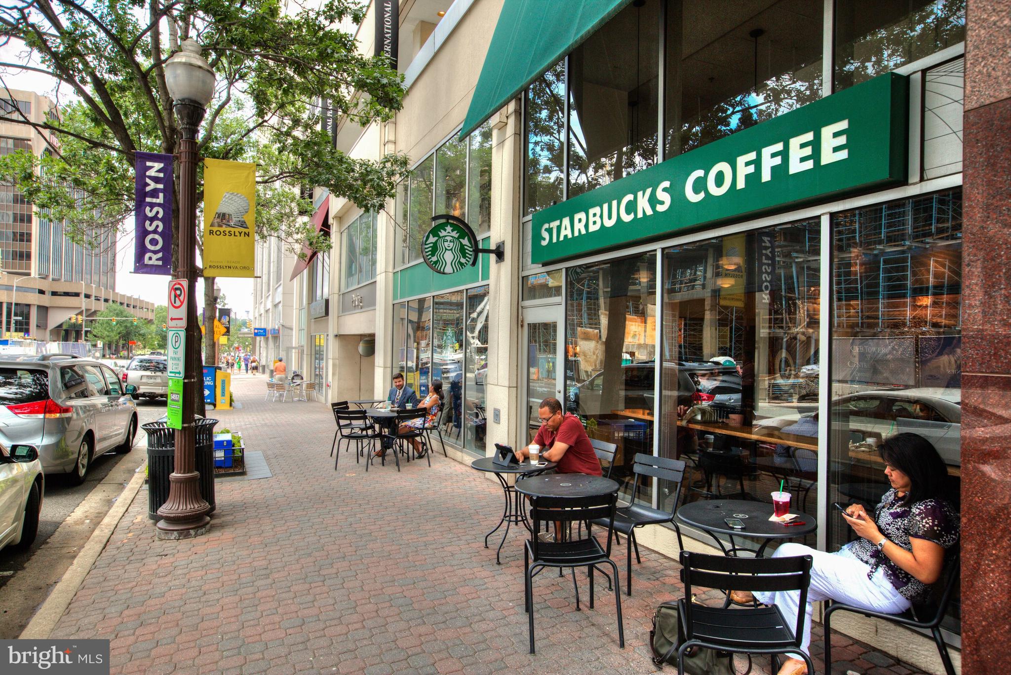 1555 North Colonial Terrace, Unit 601 Arlington, VA 22209 - Photo 23 of 24 a view of a chairs and table in patio next to a building