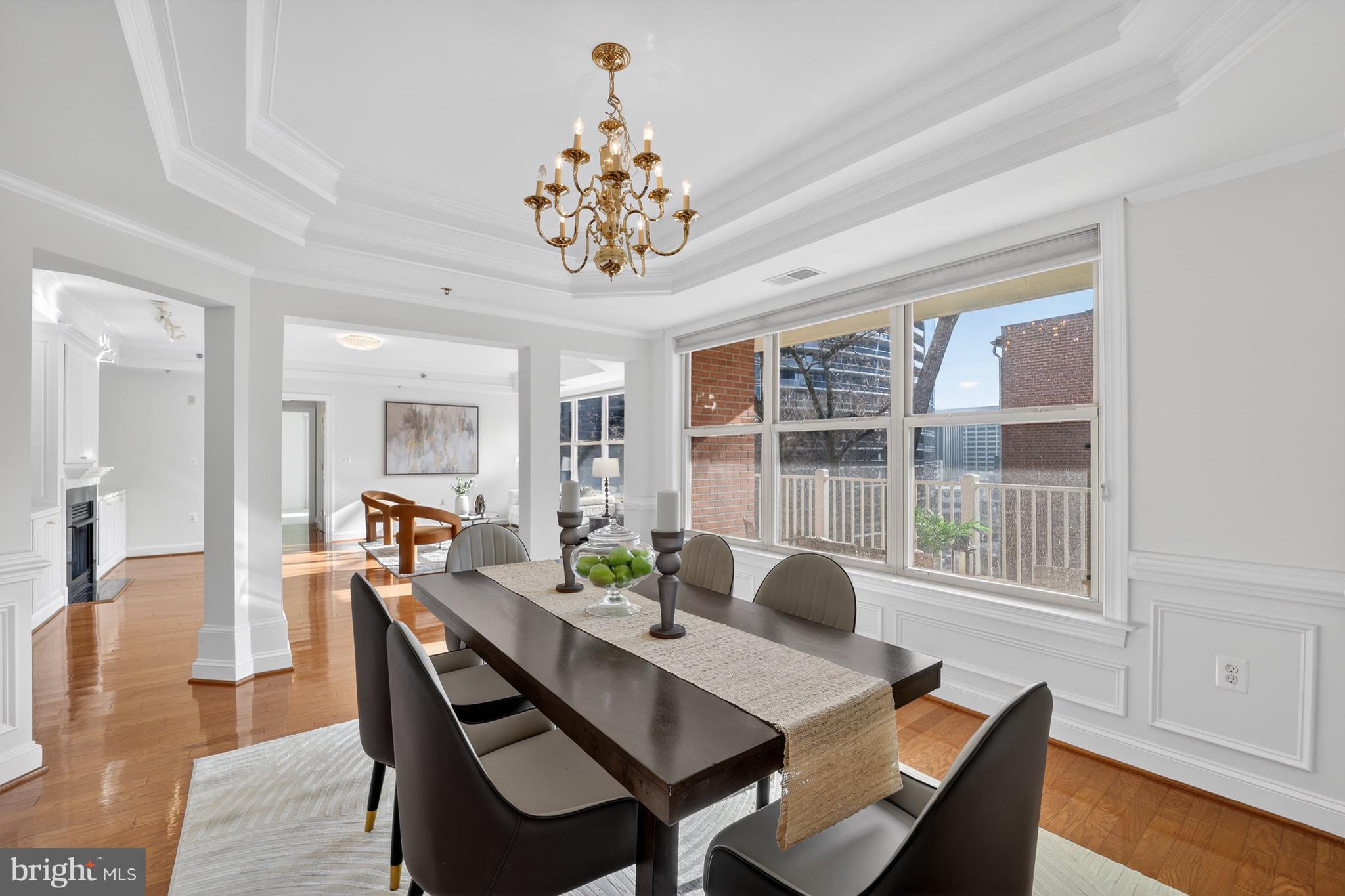 1555 North Colonial Terrace, Unit 601 Arlington, VA 22209 - Photo 8 of 24 a view of a dining room with furniture wooden floor and chandelier