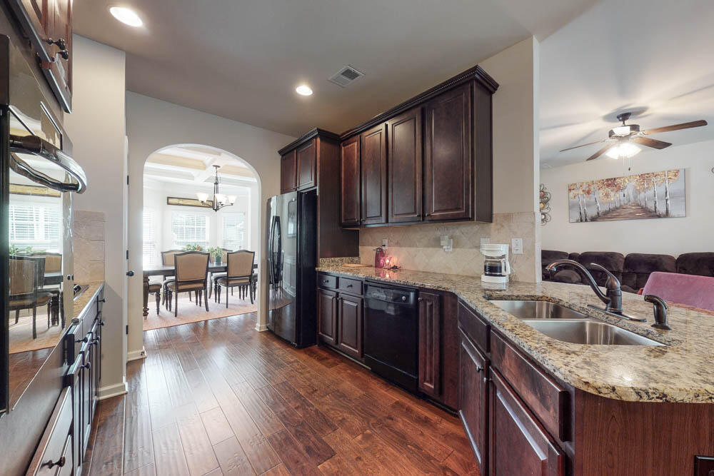 6092 Rye Field Road Aiken, SC 29801 - Photo 6 of 34 Kitchen with granite countertops, backsplash, pantry, gas range, wall oven, built in microwave & dishwasher!