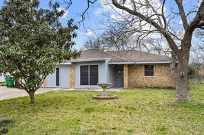 1227 Fair Drive Angleton, TX 77515 - Photo 1 of 18 a front view of a house with garden