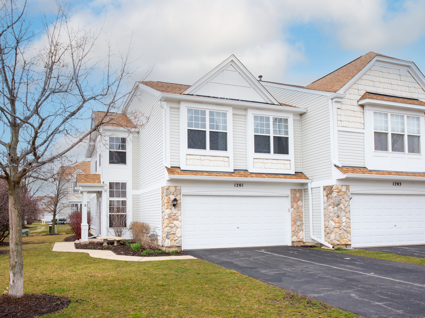 1201 Delta Drive Elgin, IL 60123 - Photo 1 of 42 a front view of a house with a yard