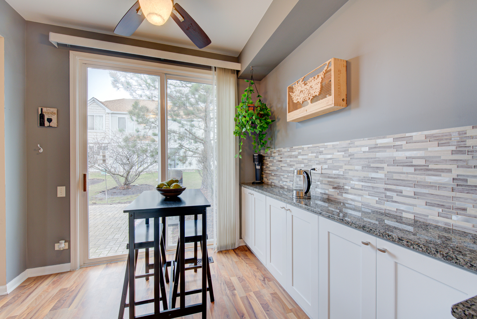 1201 Delta Drive Elgin, IL 60123 - Photo 13 of 42 a kitchen with granite countertop a sink and a wooden floor