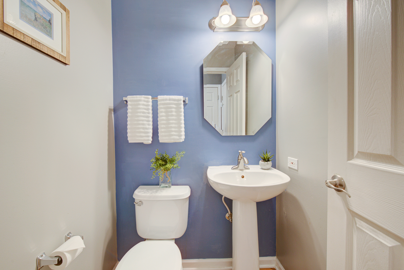 1201 Delta Drive Elgin, IL 60123 - Photo 18 of 42 a bathroom with a toilet sink and mirror