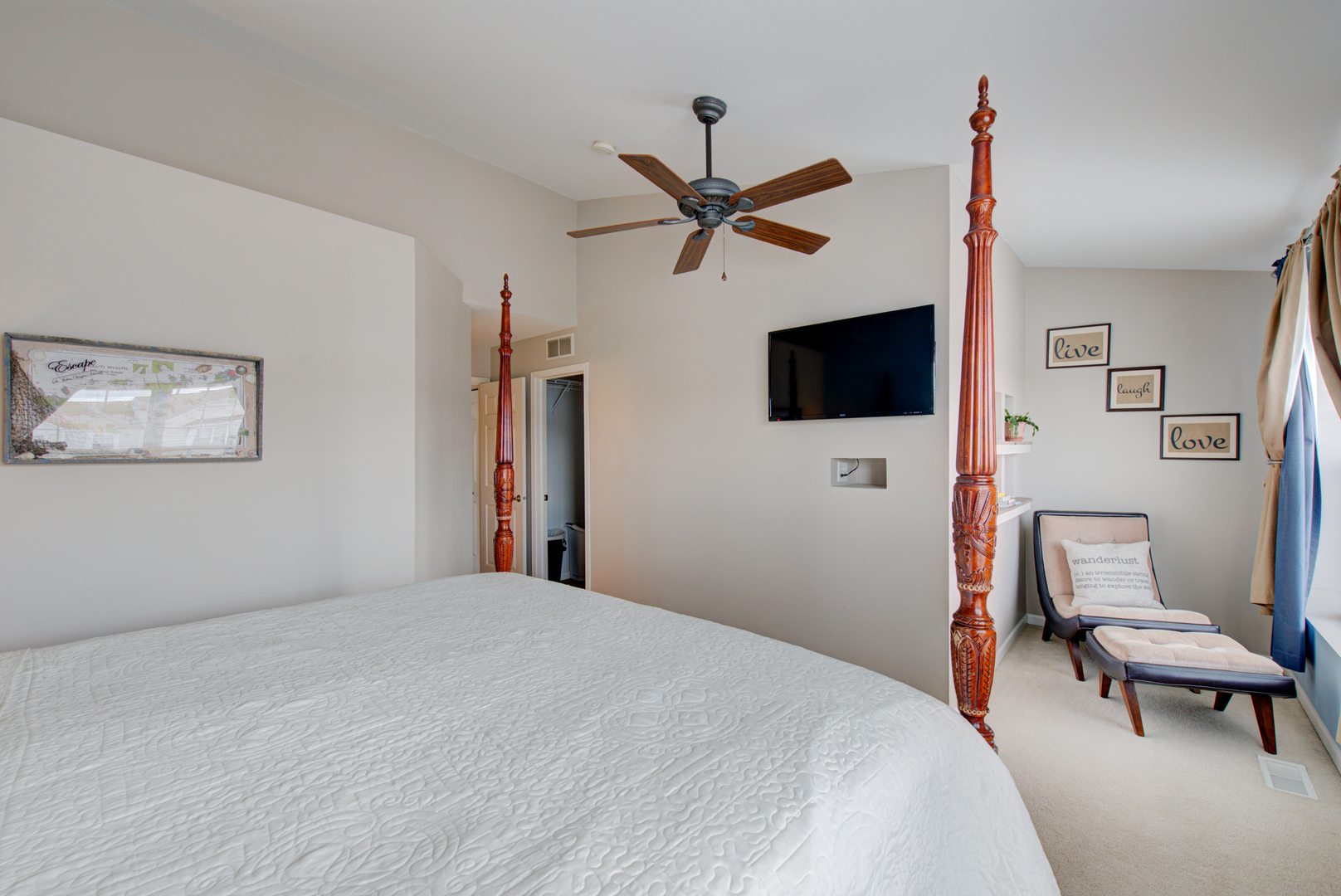 1201 Delta Drive Elgin, IL 60123 - Photo 20 of 42 a bedroom with a bed a flat screen tv and a couch