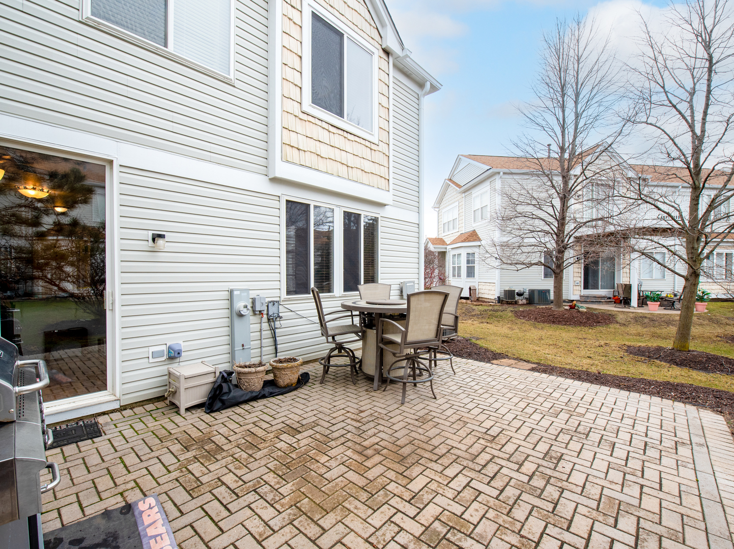 1201 Delta Drive Elgin, IL 60123 - Photo 35 of 42 a view of a patio with a table and chairs