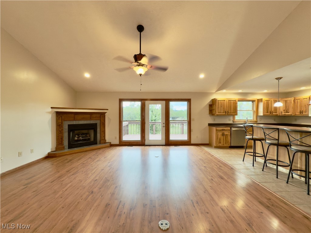 2109 Bell Road Vincent, OH 45784 - Photo 8 of 49 Living room featuring vaulted ceiling, light wood-style flooring, a ceiling fan, recessed lighting, and a fireplace