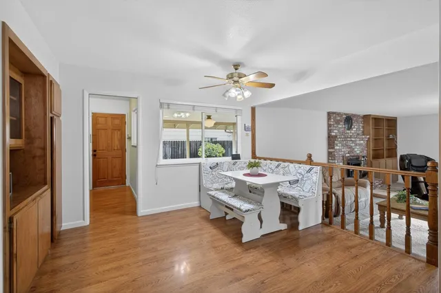 a living room with furniture and kitchen view