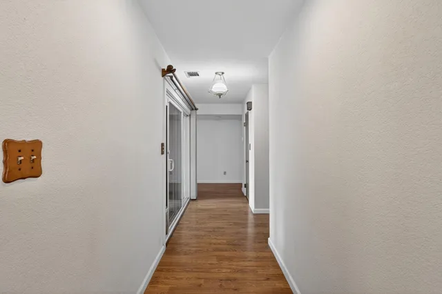 a bathroom with a tub shower vanity and view