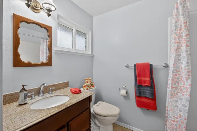 a bed sitting in a room next to a window