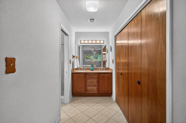 a front view of a house with flower pots