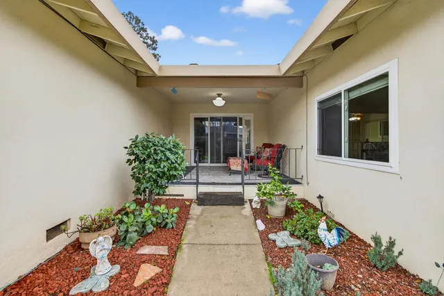 an aerial view of residential houses with outdoor space and river