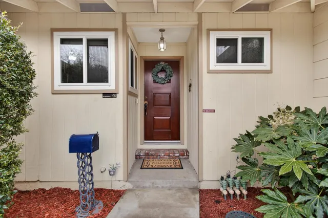 a view of living room with furniture and wooden floor