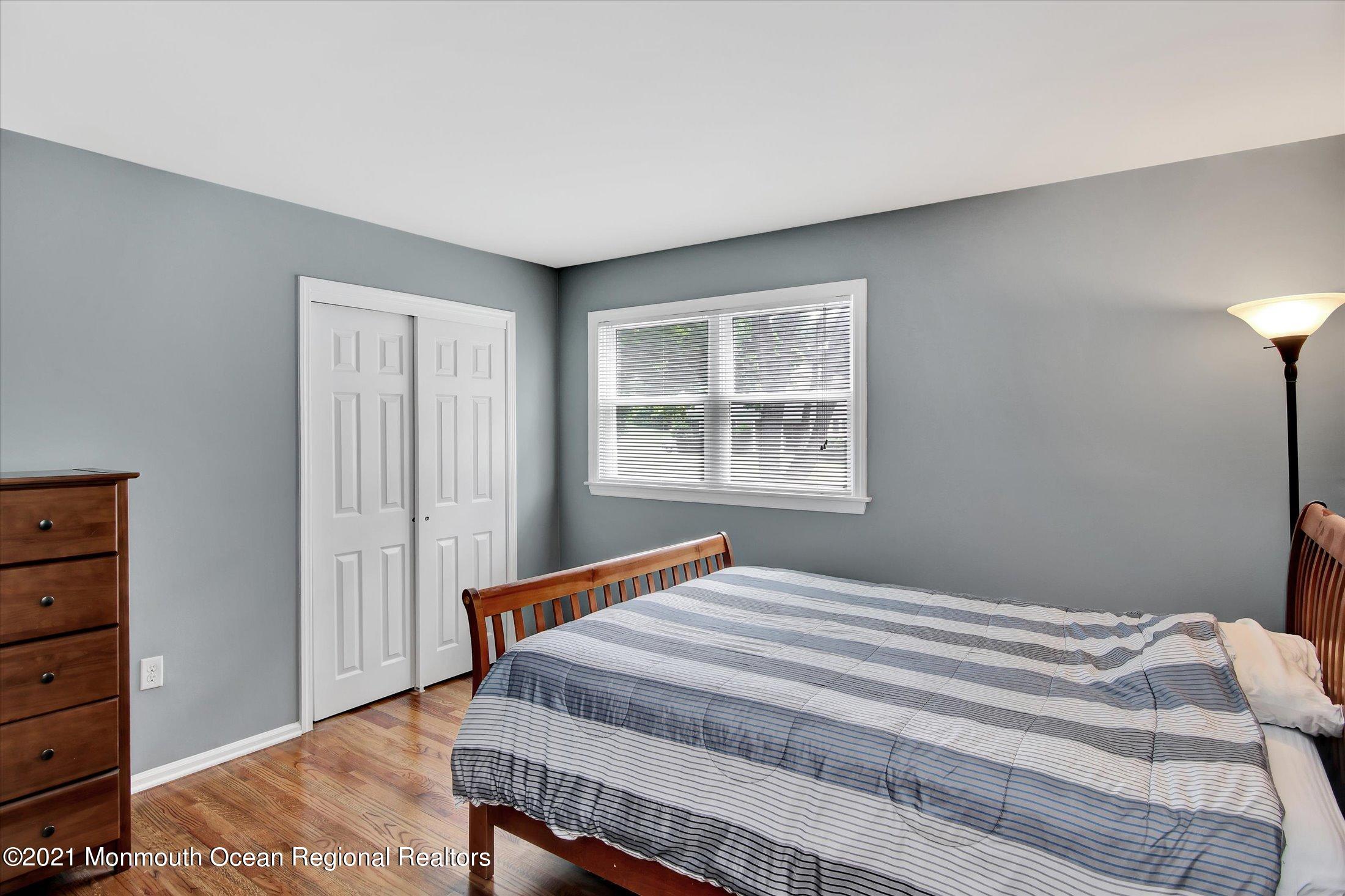 42 Hawthorne Road Red Bank, NJ 07701 - Photo 14 of 20 a bedroom with a bed and a window