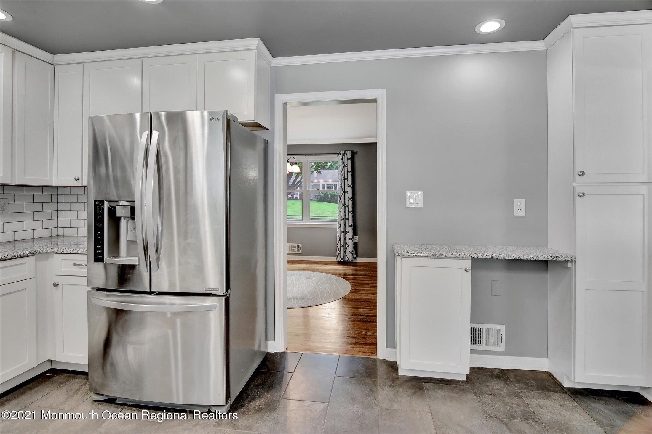 42 Hawthorne Road Red Bank, NJ 07701 - Photo 4 of 20 a kitchen with refrigerator and cabinets