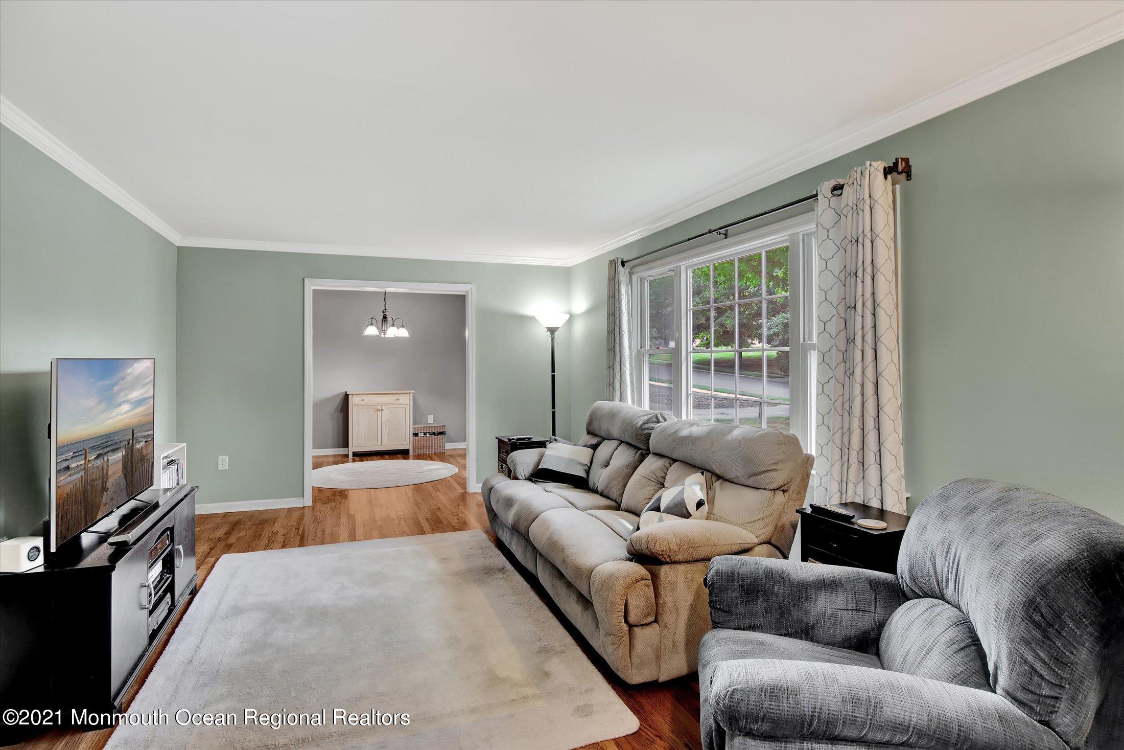 42 Hawthorne Road Red Bank, NJ 07701 - Photo 5 of 20 a living room with furniture and a flat screen tv