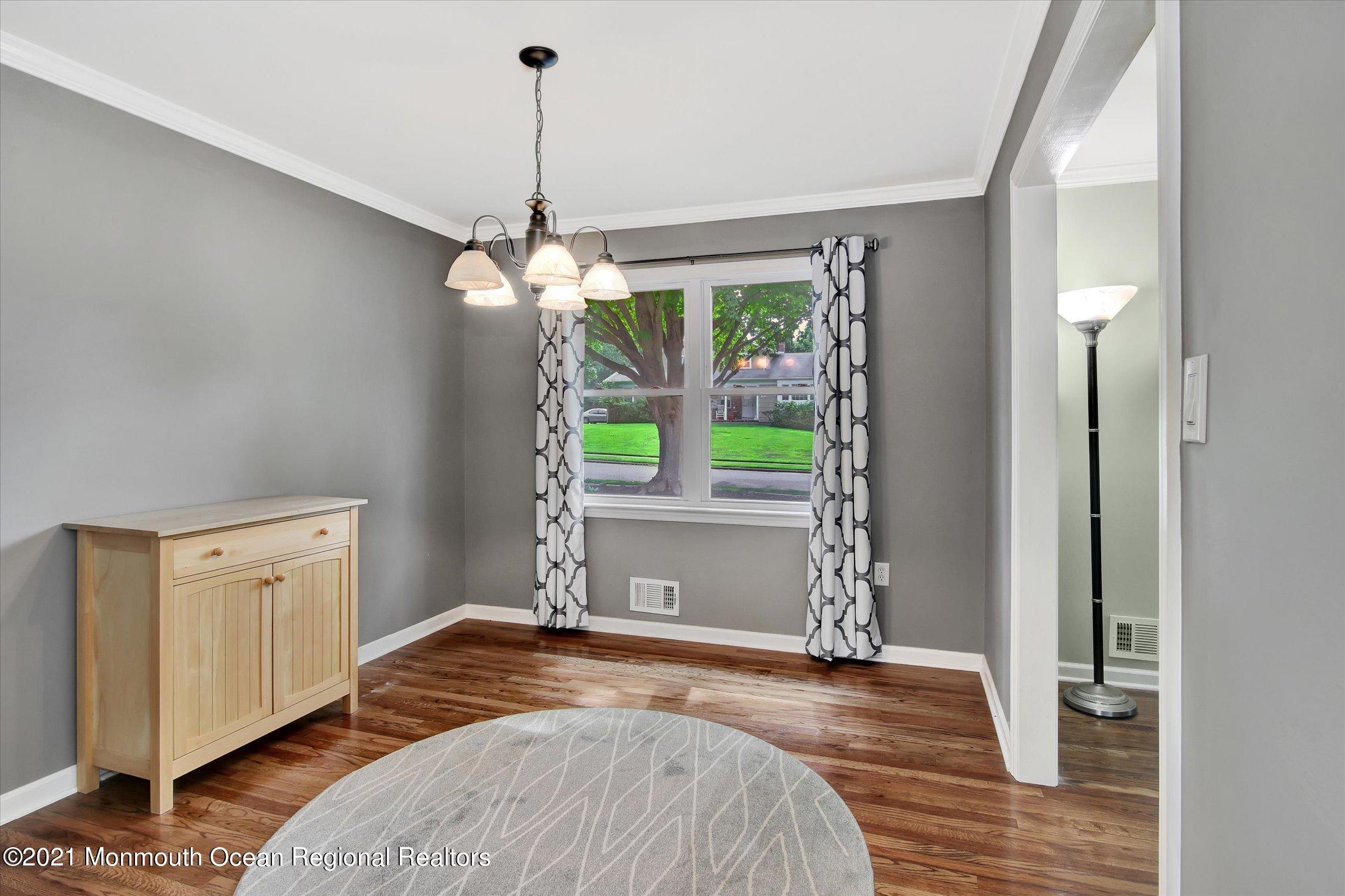 42 Hawthorne Road Red Bank, NJ 07701 - Photo 8 of 20 a bedroom with a bed and a window