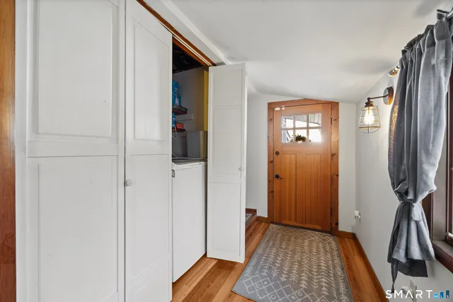 a view of storage and utility room with washer and dryer