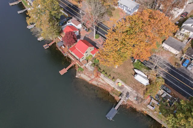 an aerial view of residential house with outdoor space and parking