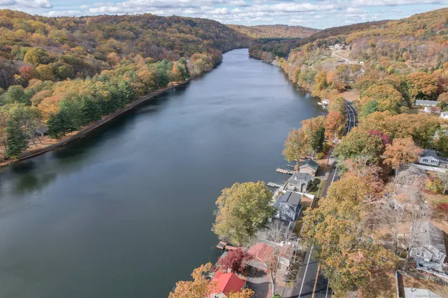 a view of a balcony with chairs and wooden floor