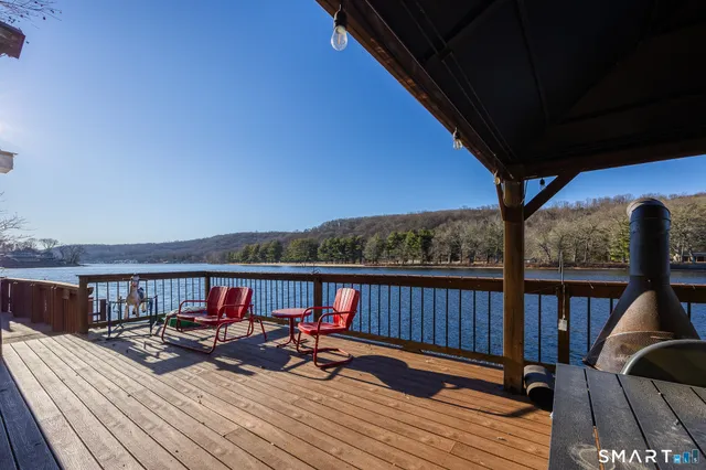 a view of a backyard with mountain view and wooden floor