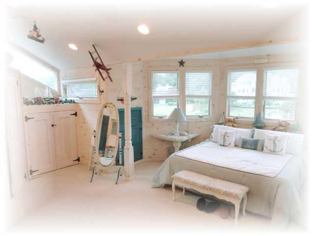 9 Chart Way Mashpee, MA 02649 - Photo 18 of 32 a living room with furniture and a large window