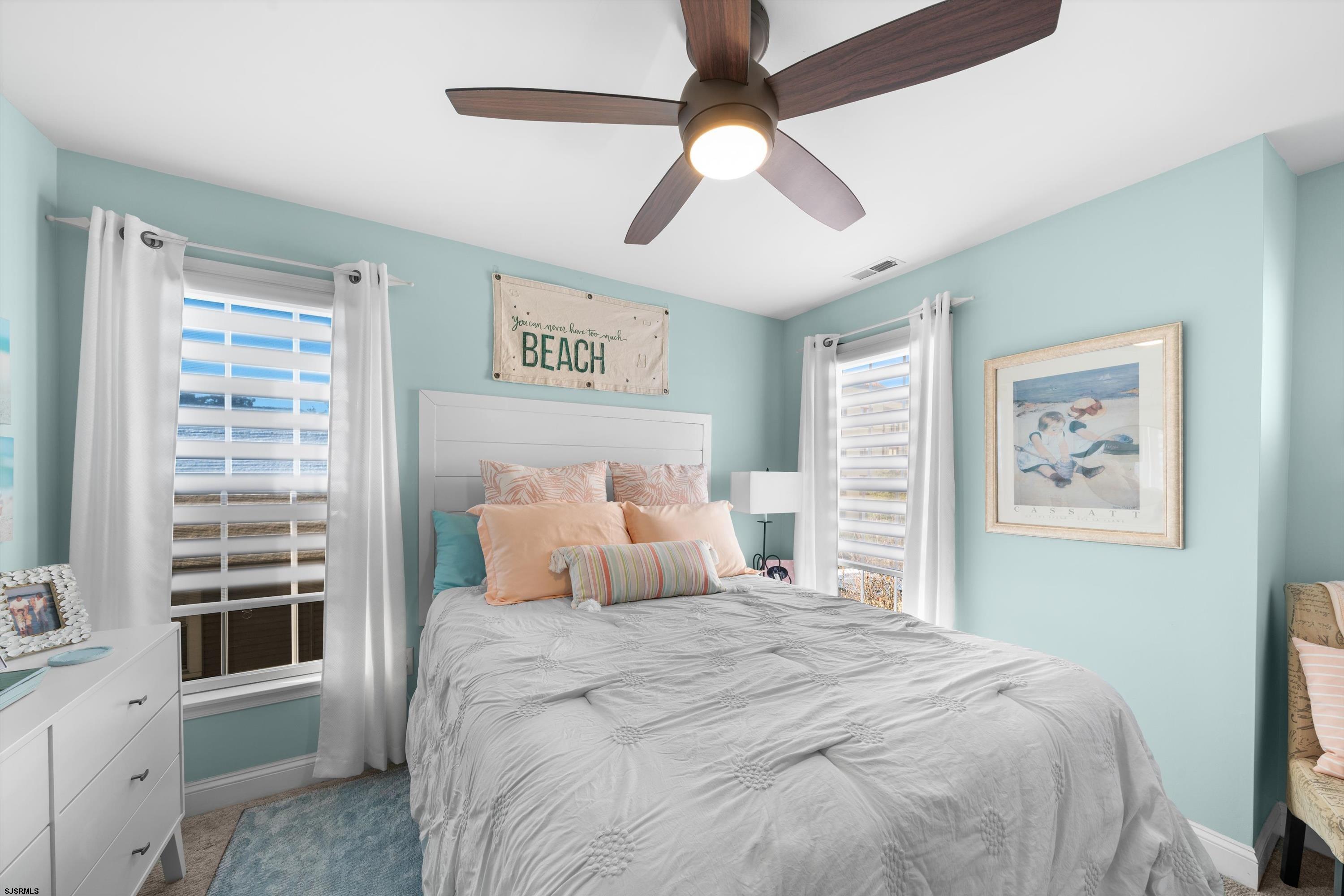 700 3rd Street Ocean City, NJ 08226 - Photo 11 of 38 a bedroom with a large bed and a window