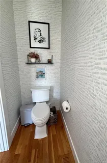 a bathroom with a toilet and a sink