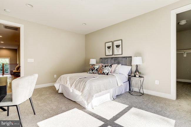 1829 Griffith Road Falls Church, VA 22043 - Photo 13 of 34 a bed room with a bed and a chair