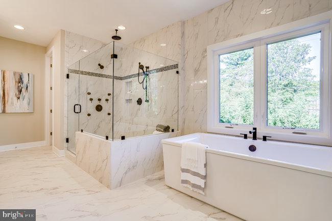 1829 Griffith Road Falls Church, VA 22043 - Photo 18 of 34 a bathroom with a tub sink and window
