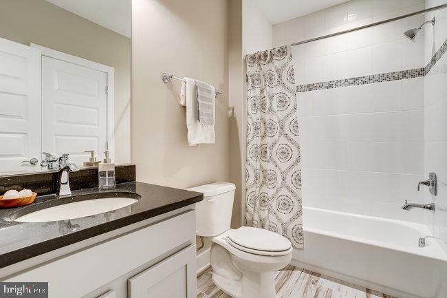 1829 Griffith Road Falls Church, VA 22043 - Photo 4 of 34 a bathroom with a sink a toilet and a bathtub