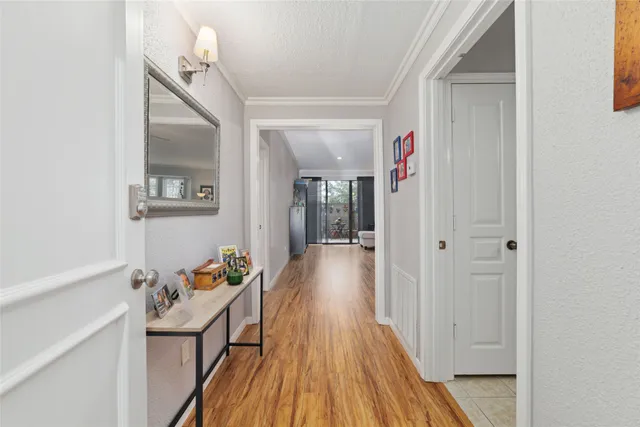 a view of a hallway view with wooden floor and staircase