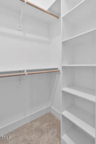 a view of an empty walk in closet