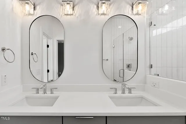 a bathroom with sinks and a mirror